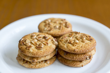 Cookies with peanuts on a white plate. Cookies close-up.