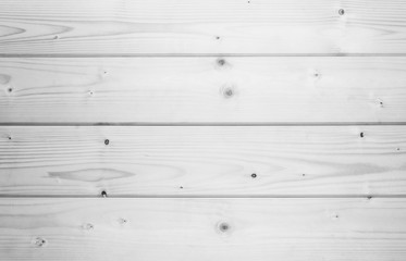 wooden background of dry polished fir planks, black and white photo
