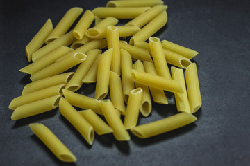 Macaroni pasta on black background