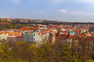 Fototapeta na wymiar Prague living blocks red rooftops with park and trees