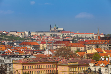 Fototapeta na wymiar Prague rooftops. Beautiful aerial view of Czech baroque architecture, churches and cathedral.