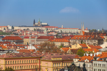 Obraz premium Prague rooftops. Beautiful aerial view of Czech baroque architecture, churches and cathedral.