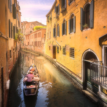 Venecia canal with boats and gondolas, Italy