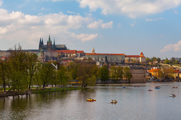 Obraz premium View on the river Vltava with boats. Old town of Prague, Czech Republic, summer season.
