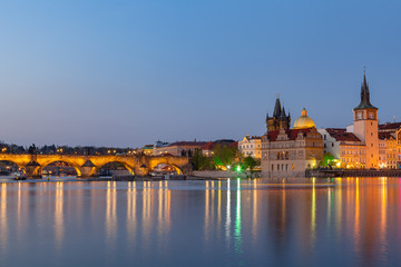Obraz premium Scenic summer evening view of the Old Town ancient architecture and the Charles bridge over Vltava river in Prague, Czech Republic