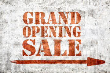 Grand opening sale -  graffiti on stucco wall