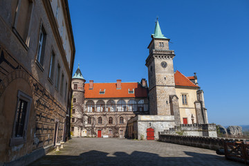 Fototapeta na wymiar Courtyard and a tower in Castle Hruba Skala, Czech Republic. Summer time.