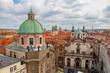 Fototapeta na wymiar View of old city with The Church of St. Francis, Klementinum, Prague, Czech Republic