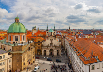 Obraz premium PRAGUE, CZECH REPUBLIC - APRIL 25, 2017: Panoramic view of old city with The Church of St. Francis, Klementinum