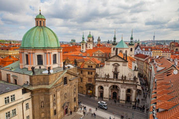 Fototapeta na wymiar PRAGUE, CZECH REPUBLIC - APRIL 25, 2017: Panoramic view of old city with The Church of St. Francis, Klementinum