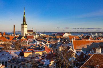 Fototapeta na wymiar Tallinn old town architecture ensemble. Aerial view of towers, red roofs and biggest church