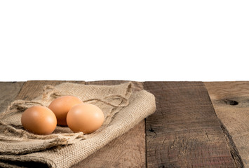 Freshly laid organic eggs on wooden bench