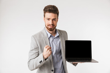 Portrait of a satisfied young man dressed in shirt