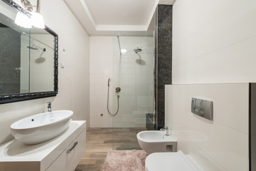 Modern bathroom interior with shower cabin in luxury villa