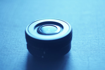 black lens on a blue background, focus