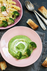 Cream of broccoli soup. Pasta with sauce and broccoli.