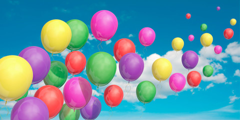 Fototapeta na wymiar Bunte Luftballons steigen gen Himmel