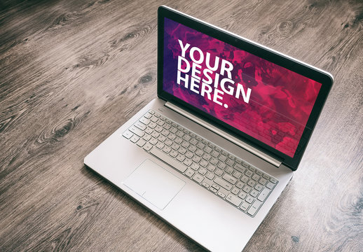 Laptop on Wooden Floor Mockup 1