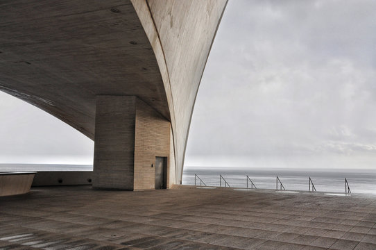 Concrete Terrace With Misterious Industrial Atlantic Ocean View In Santa Cruz Of Tenerife. Minimalistic Architecture. Cold Colors