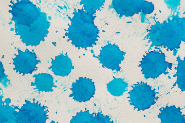 Watercolor blue abstract background. Hand made splashes on watercolor grainy textured paper.