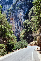 The road through the gorge Therisso on the island of Crete .