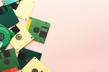 Retro floppy disks isolated on pink background
