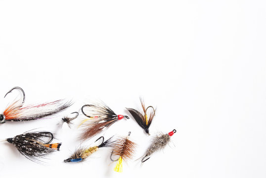 A Lot Of Fishing Flies On White Background