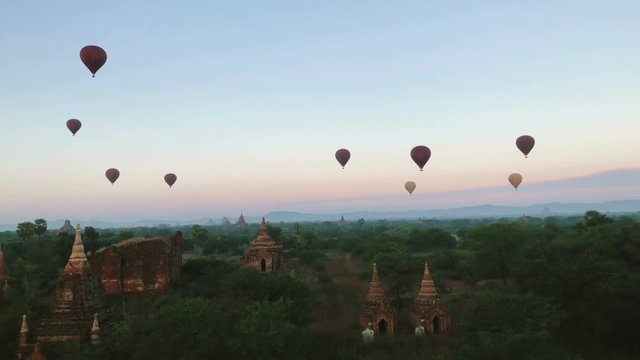 Time lapse of Hot Balloons flying over Bagan Temples in the sky. Bagan Pagodas in Mandalay Region of Myanmar