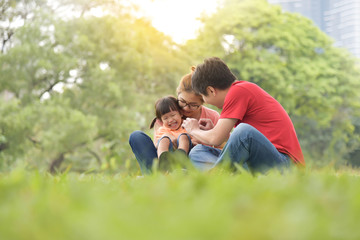 Happy Asian family having fun.