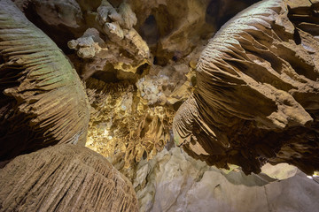 Beautiful illuminated cave formations and stalactites