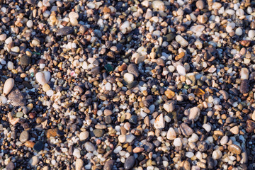  Beautiful beach and pebbles on mediterranean sea beautiful macro with a soft focus. Colored pebbles at the coast sea.