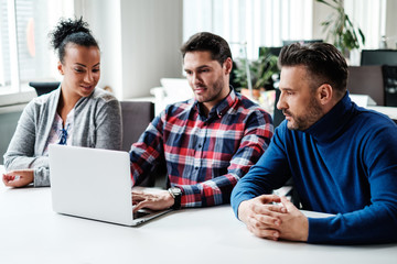 Multi-ethnic colleagues in a coworking office.