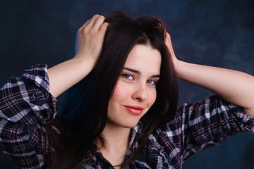 Young beautiful woman with long dark hair studio shoot. Natural beauty, healthy skin and hair concept