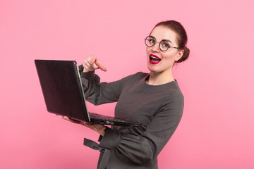 Businesswoman with hair bun and laptop