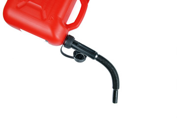 .Part of a red canister for fuel with a hose. Isolated background