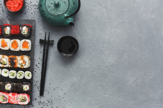 Top view set of sushi maki and rolls on grey table