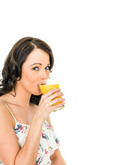 Young Woman Holding And Drinking A GLass Of Fresh Healthy Orange Juice
