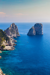 Fototapeta premium Separate rocks against the background of the sea - a natural or travel background. Place under the text