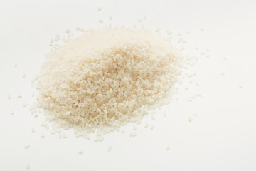 Pile of rice on white background