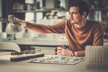 Man working in design and engineering architecture office.