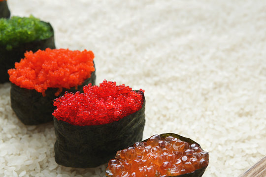 Closeup of sushi gunkan on white rice background