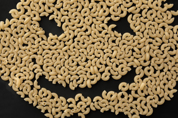 smile macaroni black background