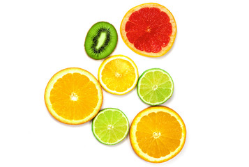 pieces of orange lemon, kiwi, and greyfruit and lime on a white background