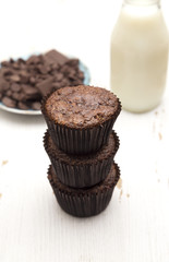 Whole Wheat Double Chocolate Chip Muffins on a Rustic White Wood Table