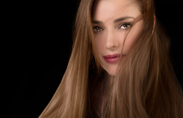 Naklejka premium Long-haired beautiful woman with tousled hair style.