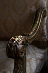 detail of wooden armchair arm