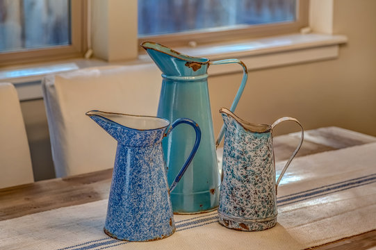 Three Vintage Blue Enamel Pitchers