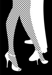 Legs of woman and man dancing tango. Legs of woman wearing fishnet stockings and high heels.