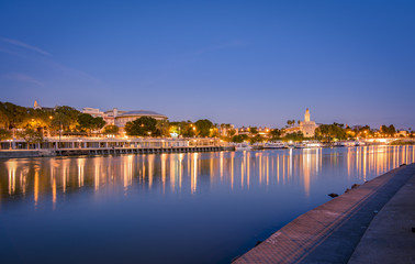 Blue hour view of Seville from Triana quarter.
