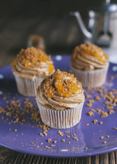 Brown Orange Cupcake decorated on plate